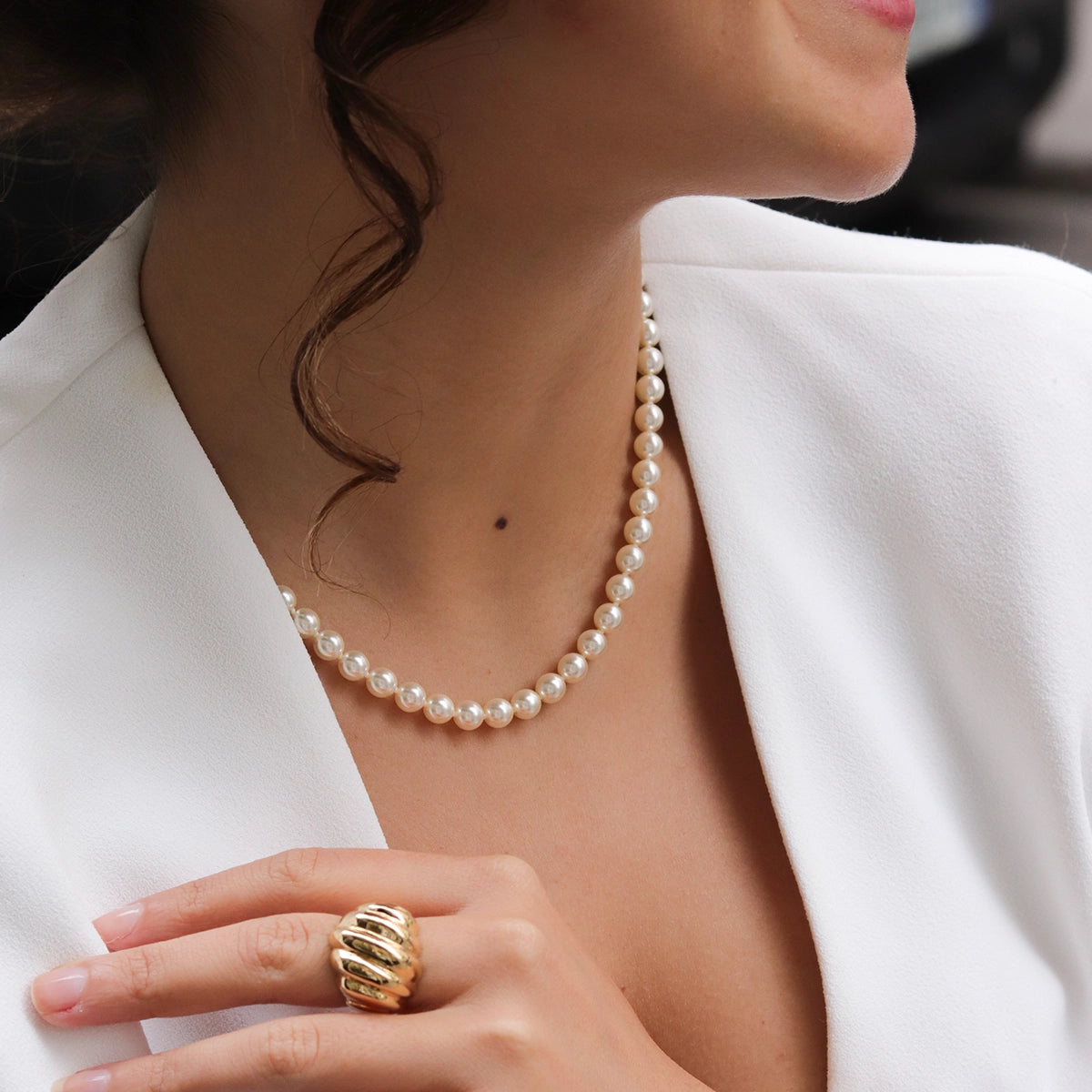 pearl necklace worn