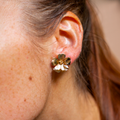 Worn flower earrings
