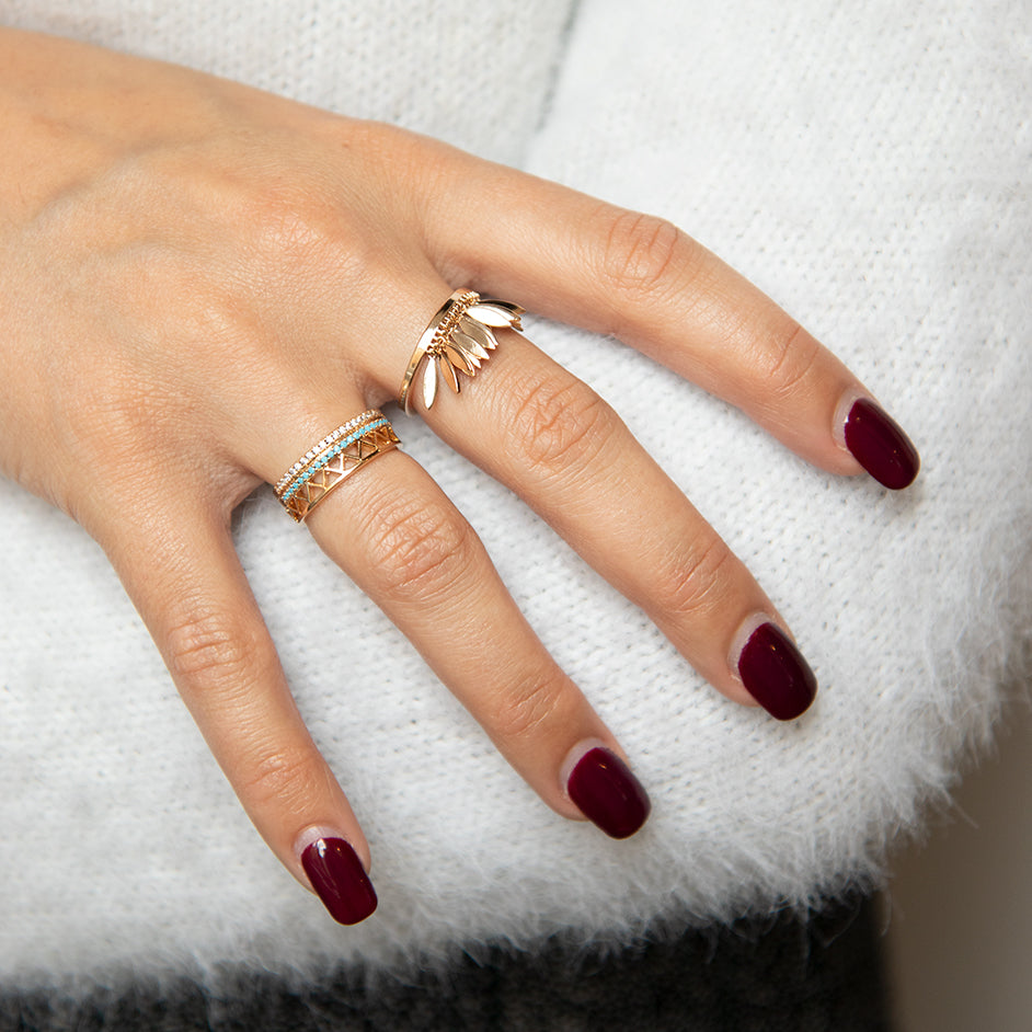 gold-plated feather ring worn