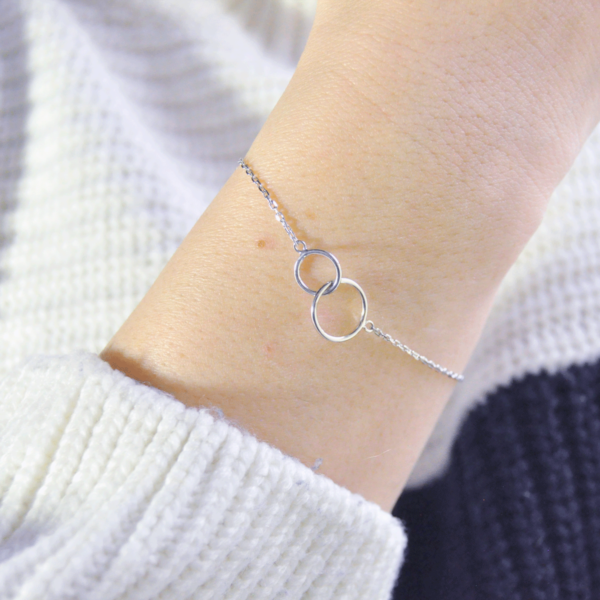 Bracelet with two silver rings worn