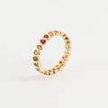 fine ring with colored stone seen in profile