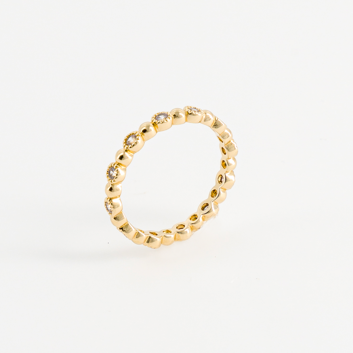 Thin gold-plated ring seen in profile
