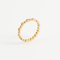 Thin gold-plated ring seen in profile