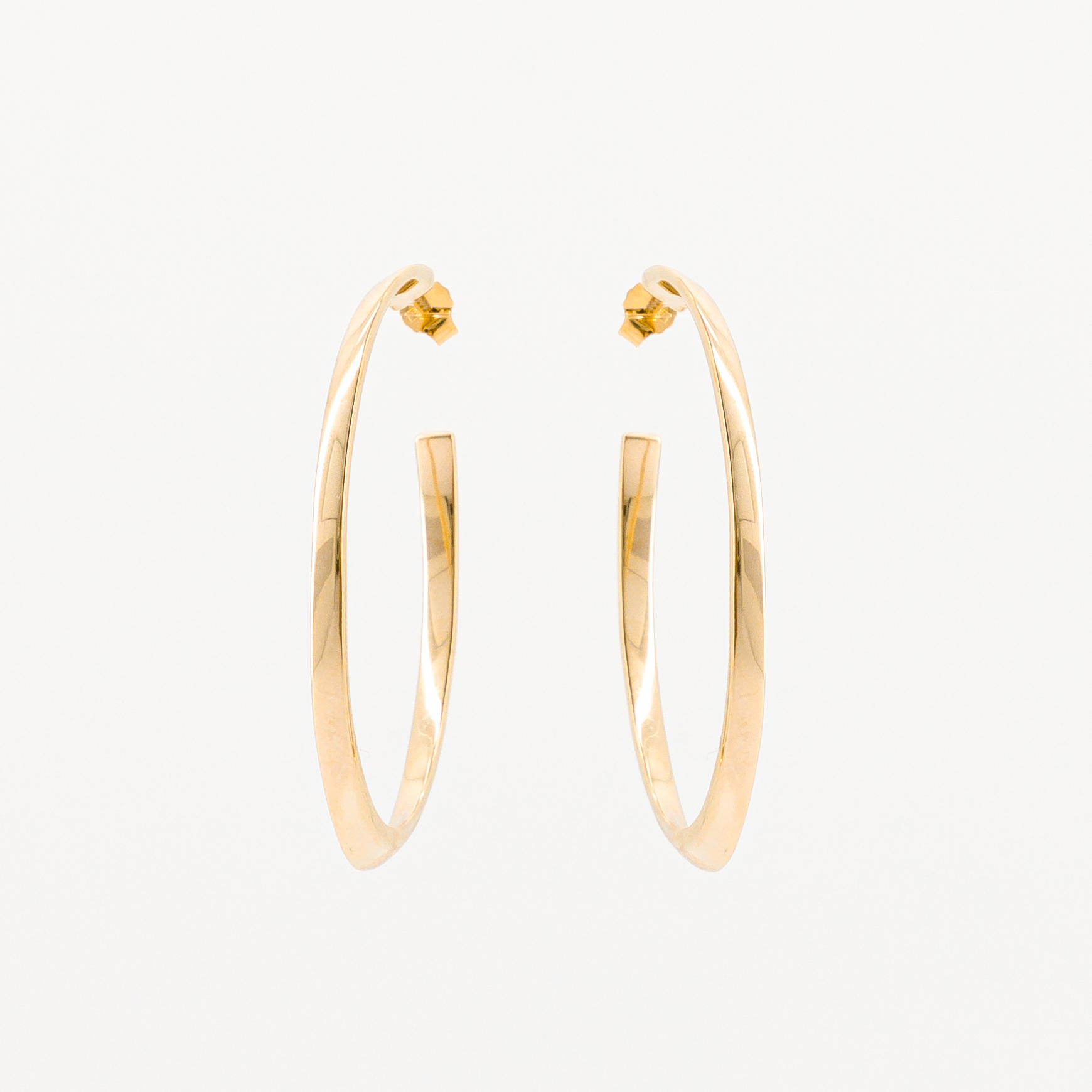 Gold-plated oval hoop earrings, front view
