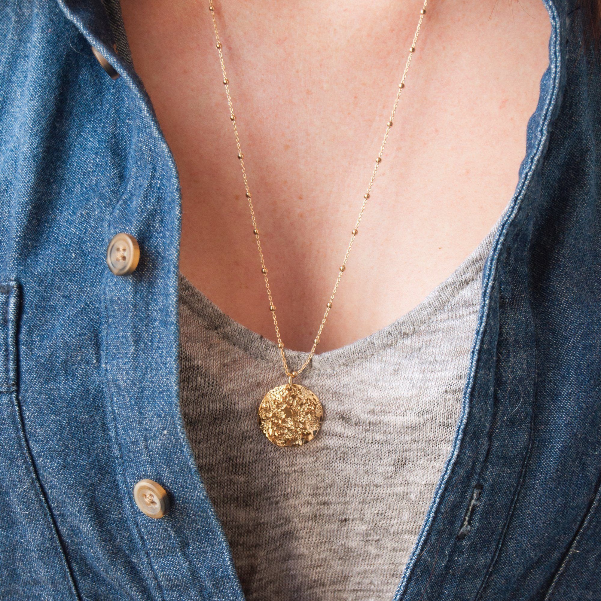 gold-plated moon necklace worn alone