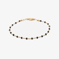 bracelet perles noires plaqué or